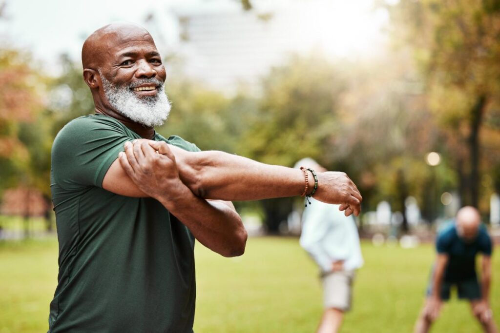 Man stretches and he thinks about the many benefits of medication management