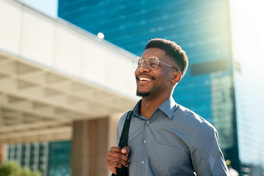 Man smiles and heads to class after learning tips for a successful recovery