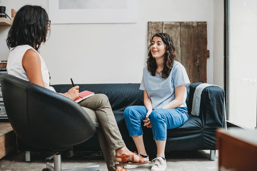 Woman talks to therapist about the importance of mental health treatment